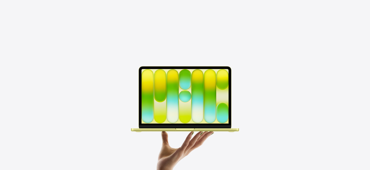 جهاز MacBook Neo بلون أصفر سيتروس ساطع، ويد مفتوحة ترتفع وتقوم بتدوير MacBook Neo لتكشف عن نمط تجريدي غني بالألوان على الشاشة