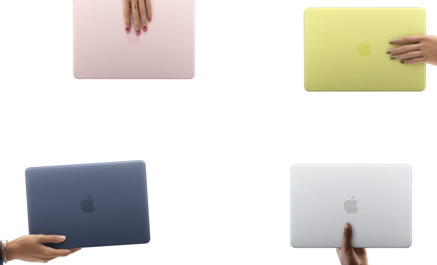 MacBook Neo laptops in various colours, each held in a different person's hand